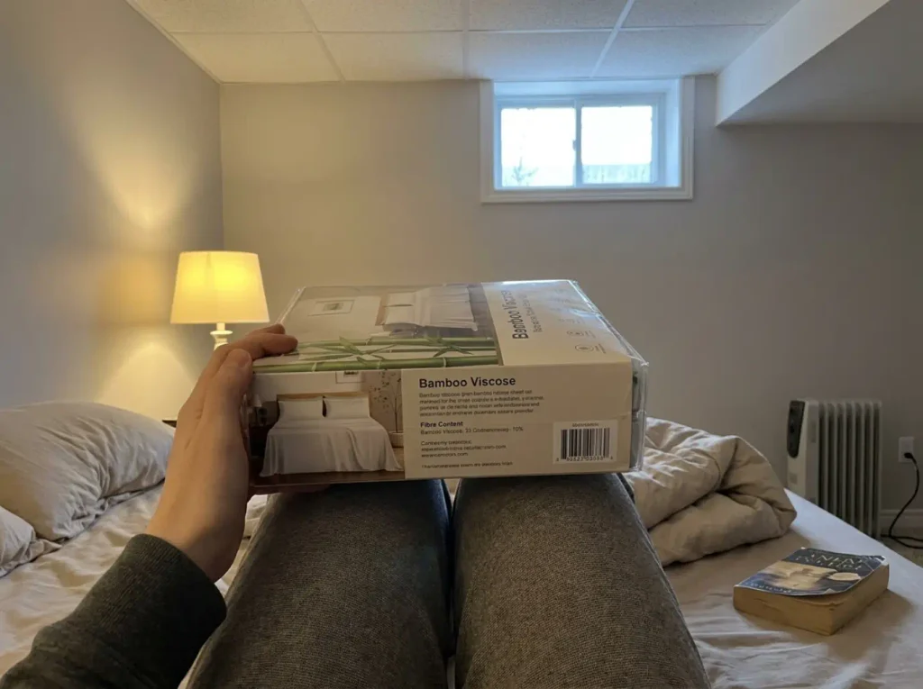 A bamboo sheet set package turned over to read the fiber content panel on the back