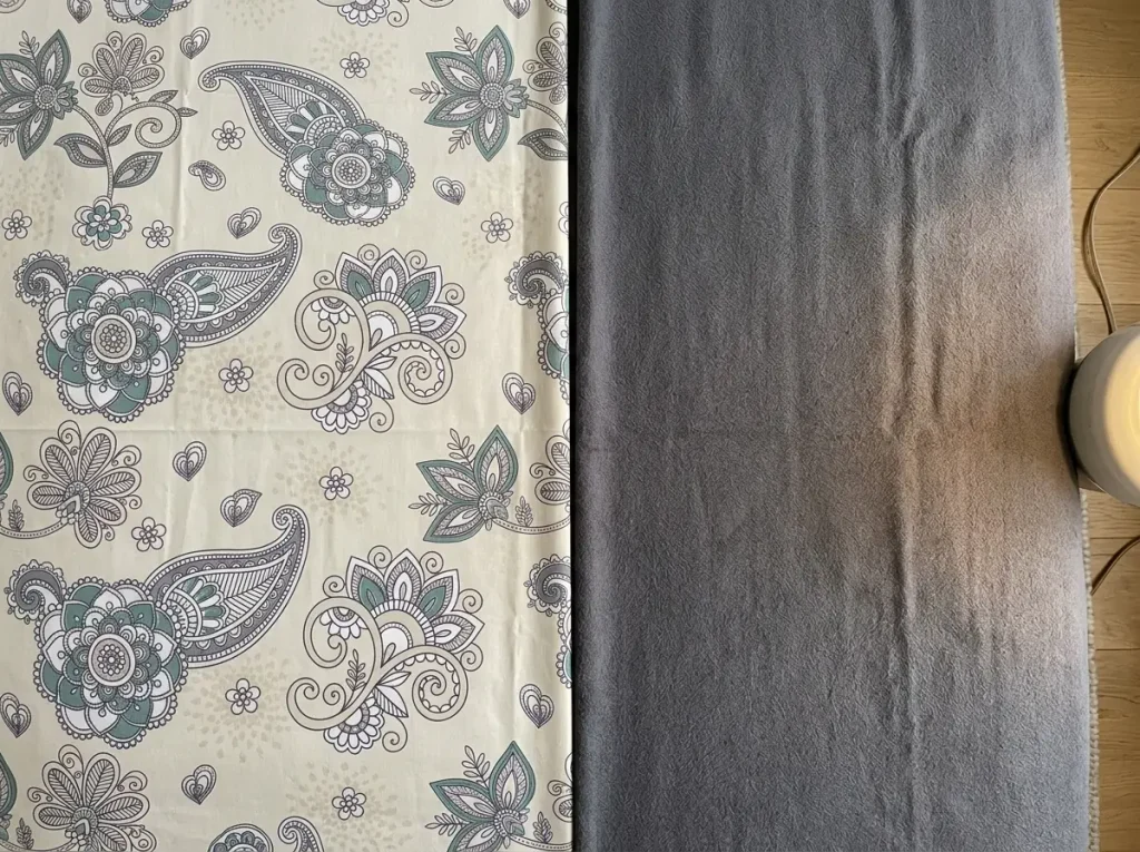 A crisp percale sheet and a brushed flannel sheet laid side by side to compare their surfaces