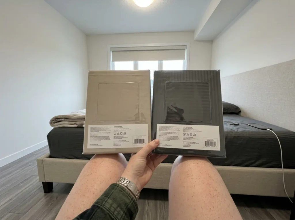 Two cotton sheet packages turned face down side by side to compare their construction panels