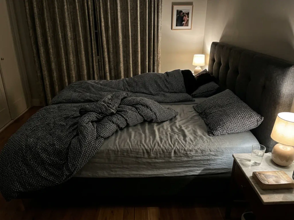 Two duvets slept in asymmetrically at 3 a.m., one thrown back and one undisturbed